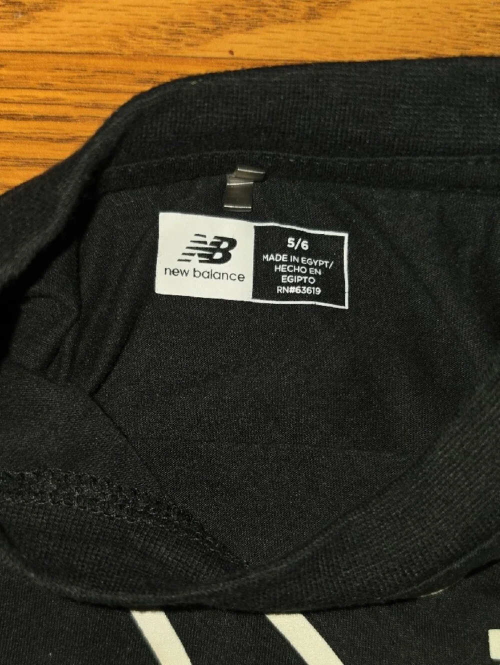 New Balance Black Tee with White Basketball Graphic